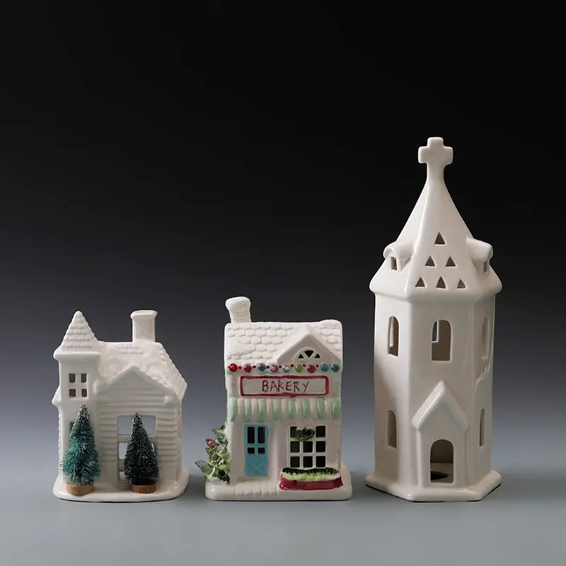 Multicolor ceramic Christmas houses with hand-painted festive details and illuminated openings for holiday displays