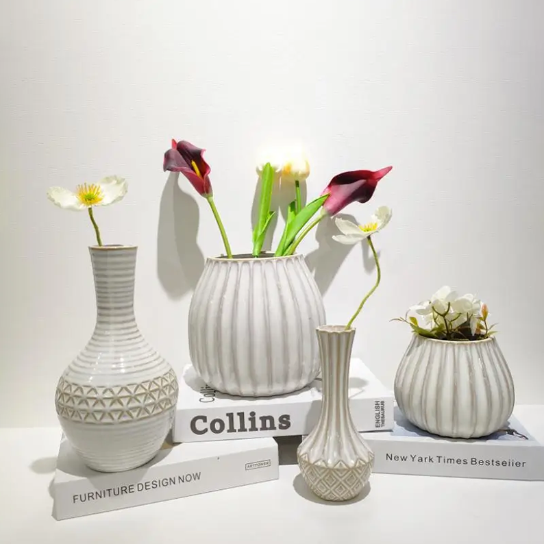 Ceramic vase collection featuring natural two-tone reactive glaze effects with varied decorative forms