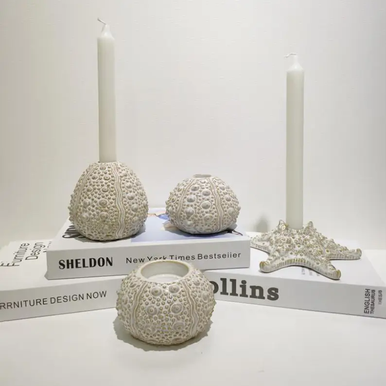 Ceramic shell candle holder designs with ocean inspired textures, combining artistic decoration and functional lighting accessories for interior styling.