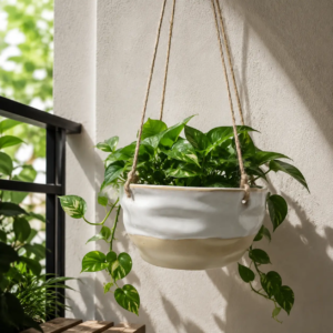 Hanging ceramic planter featuring reactive glaze effects, natural kiln-fired color variation and handcrafted ceramic surface for balcony and indoor plant decoration