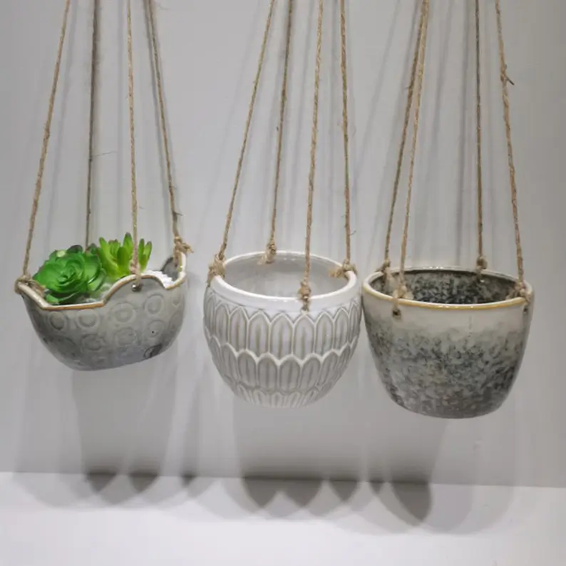 Small hanging ceramic planter designed for succulents and compact indoor plant displays