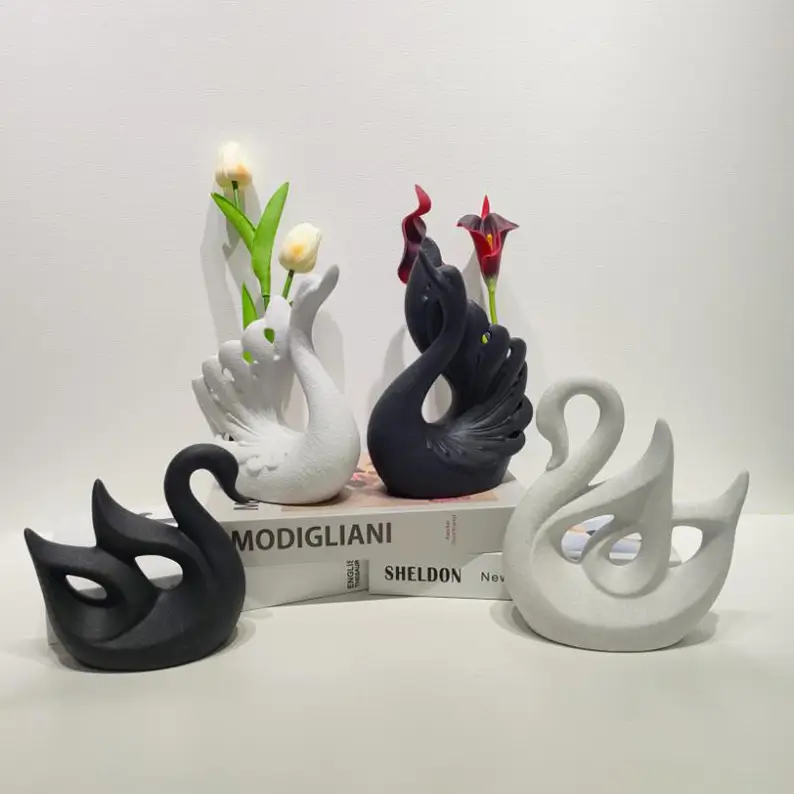 Swan ceramic pieces arranged with flowers, showing vase functionality and elegant floral presentation for romantic occasions.