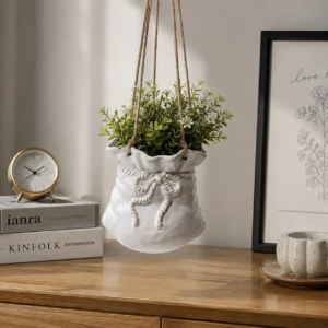 Hanging ceramic planter with decorative textures and reactive glaze surface effects for modern interiors
