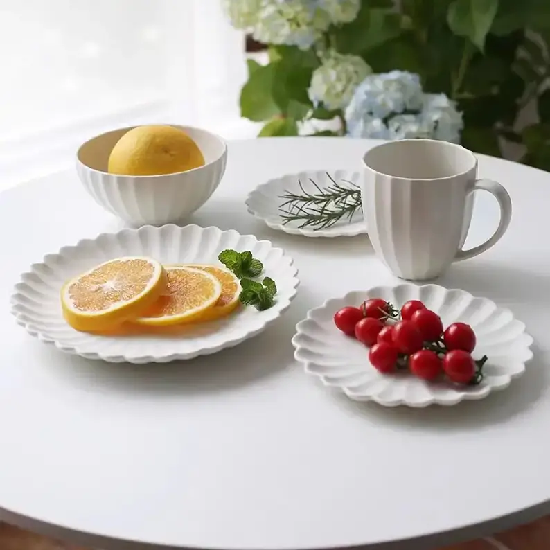 Complete ivory white matte ceramic dinnerware set with plates,bowls and mugs for home hotel matching