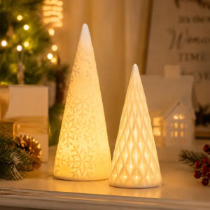 TYY2503 ceramic Christmas tree decorations arranged on a holiday mantel with festive greenery and warm seasonal styling for Christmas home display.