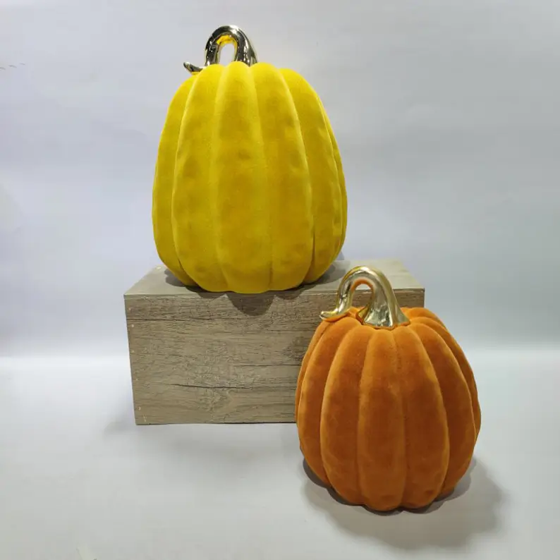 TYY2503 flocked pumpkin decorative figurines in yellow and orange with electroplated stems for Halloween seasonal decoration.