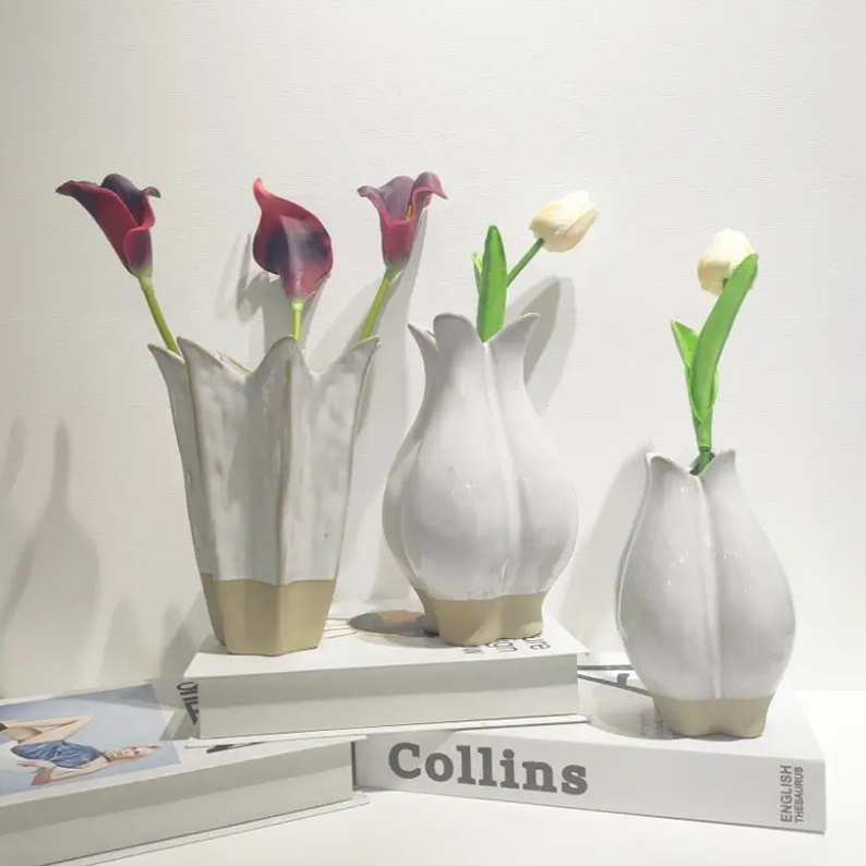 Collection of glazed ceramic vases featuring different silhouettes and natural kiln-fired color variations