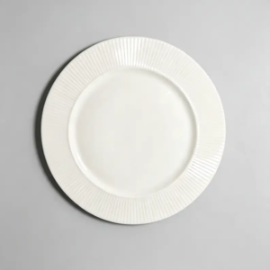Close-up of dense radial narrow rim fluted texture on a ceramic plate surface