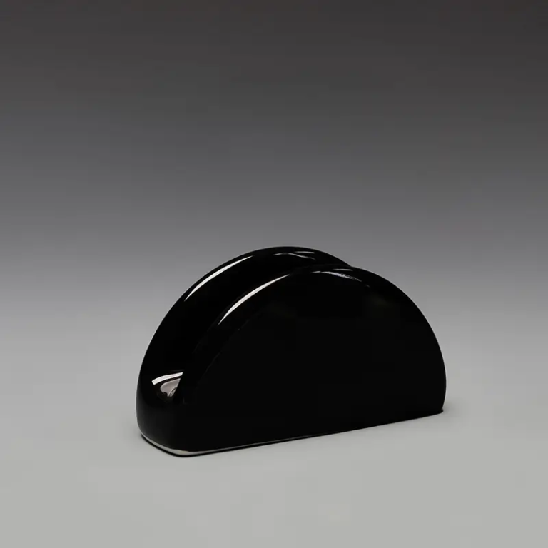 017A black ceramic napkin and hand towel holder with a rounded arch profile for restaurant and hotel table settings.