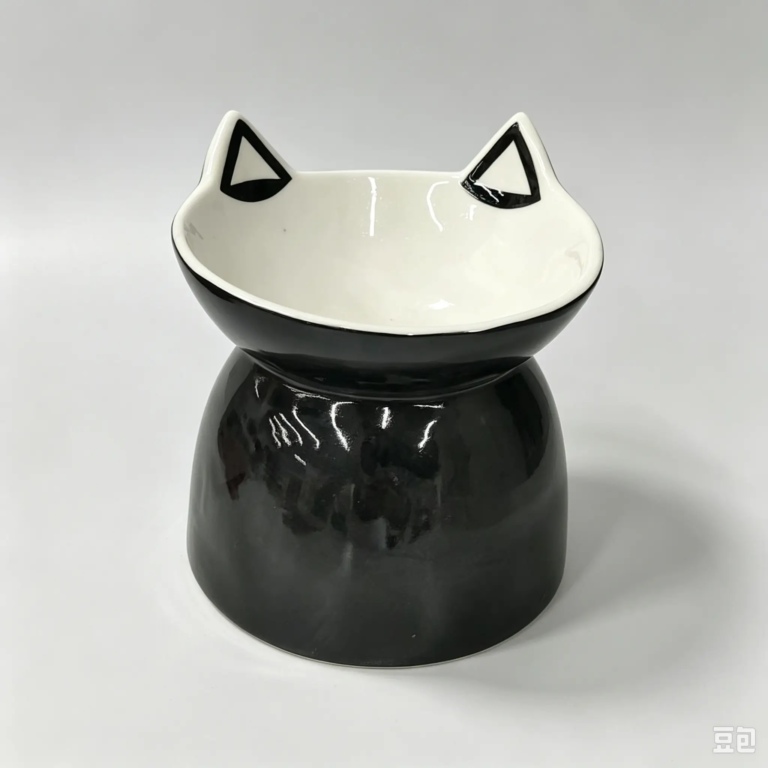546L black ceramic pet bowl with a raised ear-shaped design and rounded base.