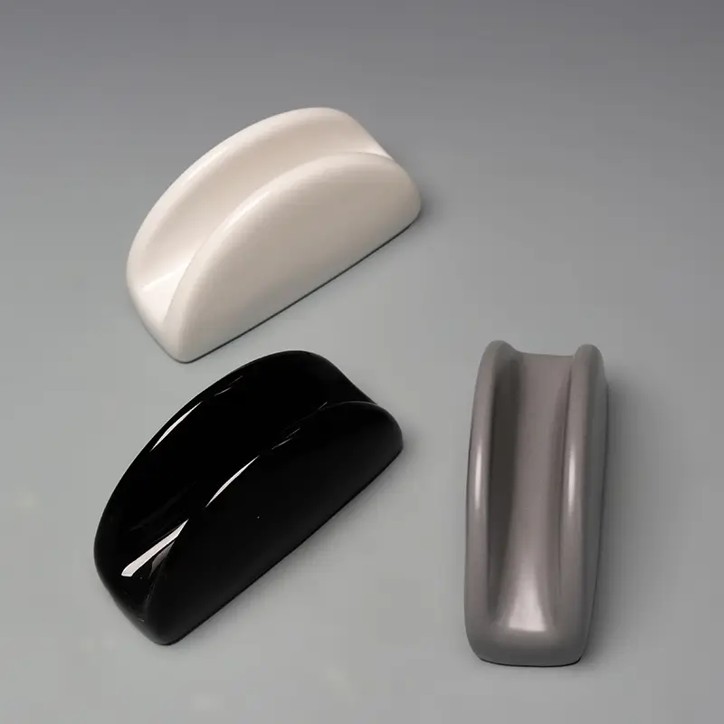 TYY2511017A ceramic holder color detail showing the smooth curved form and central opening for folded napkins or hand towels.